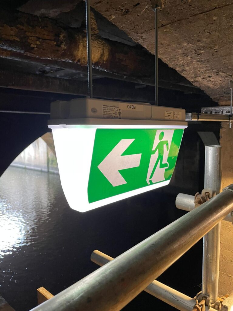 A green fire exit sign