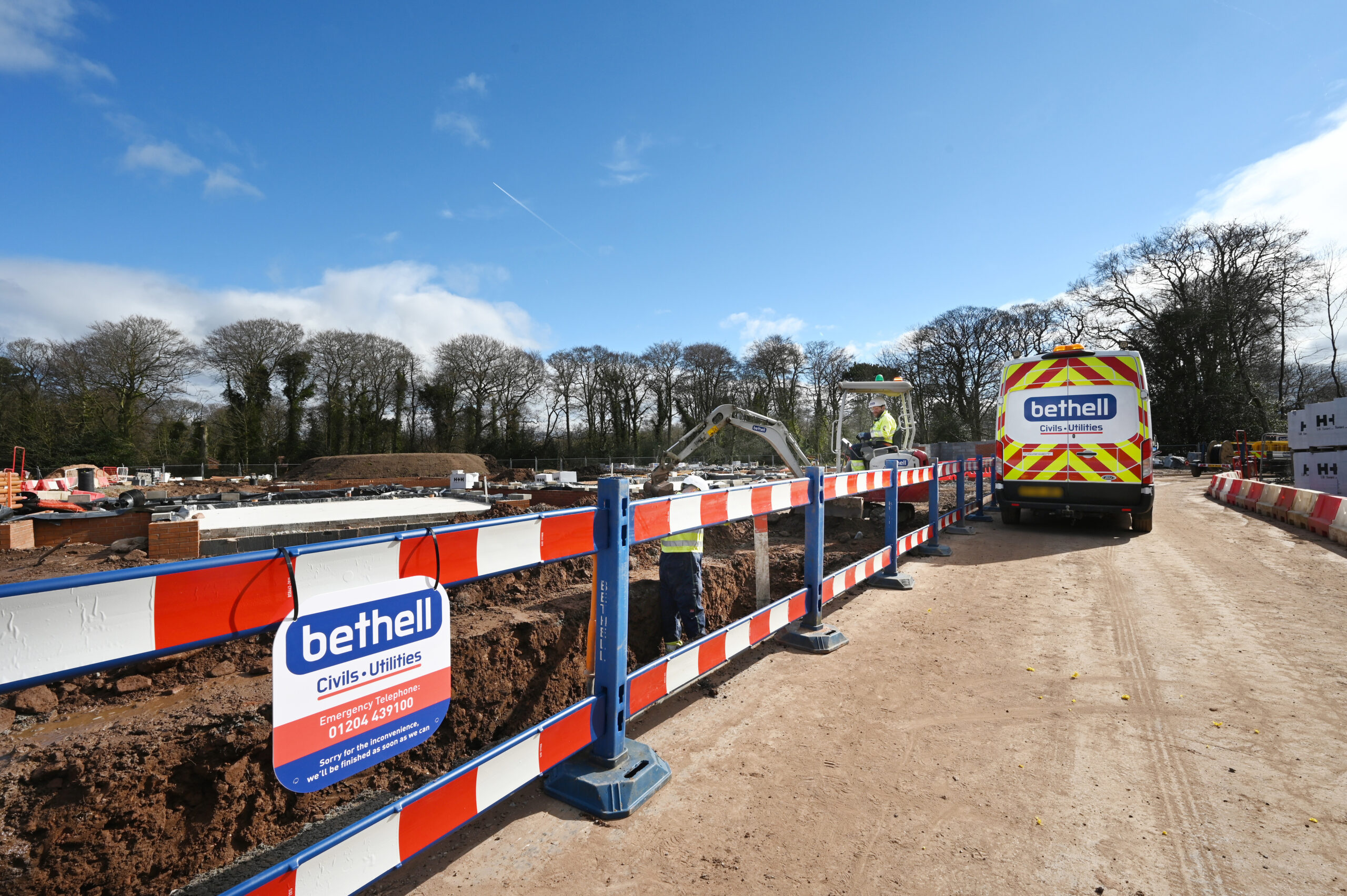 Bethell operatives laying utility cables in a trench
