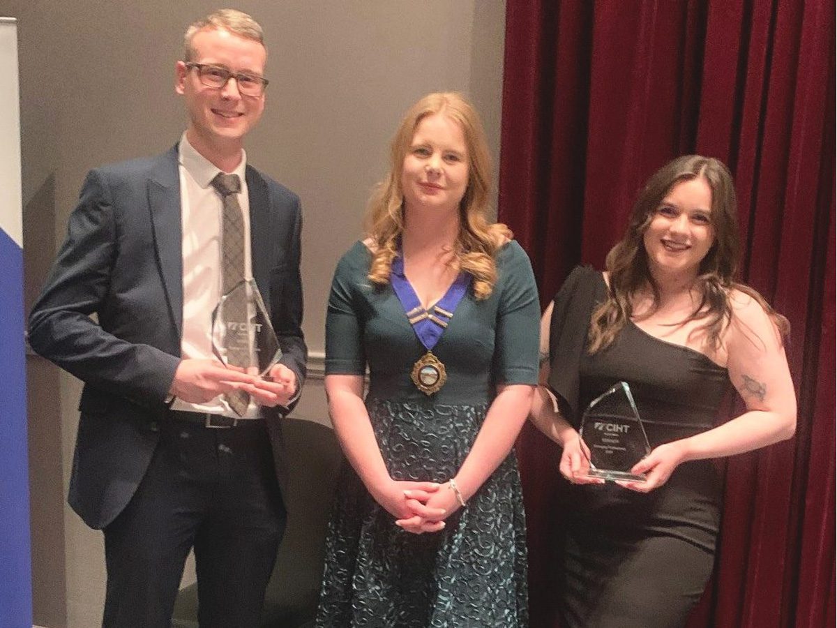 Group of people accepting an award at an industry awards ceremony