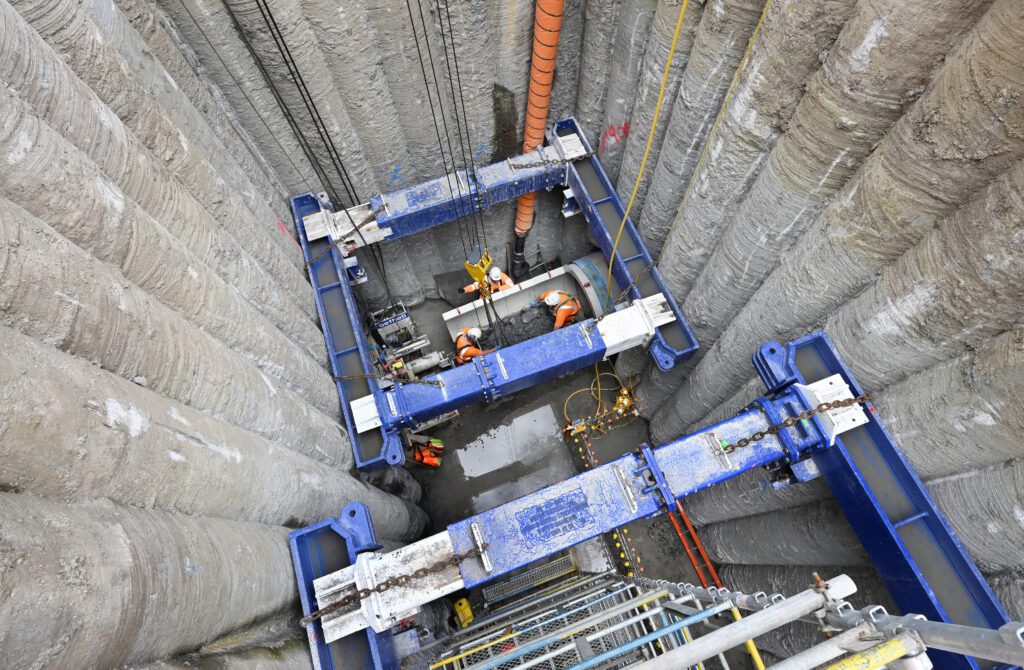 Operatives working in an underground chamber