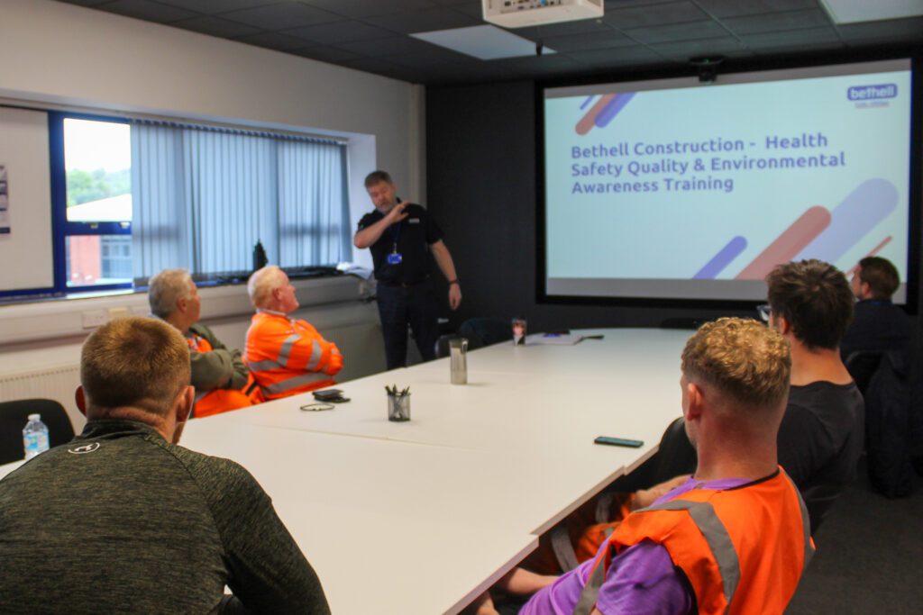 A group of operatives attending a safety training meeting