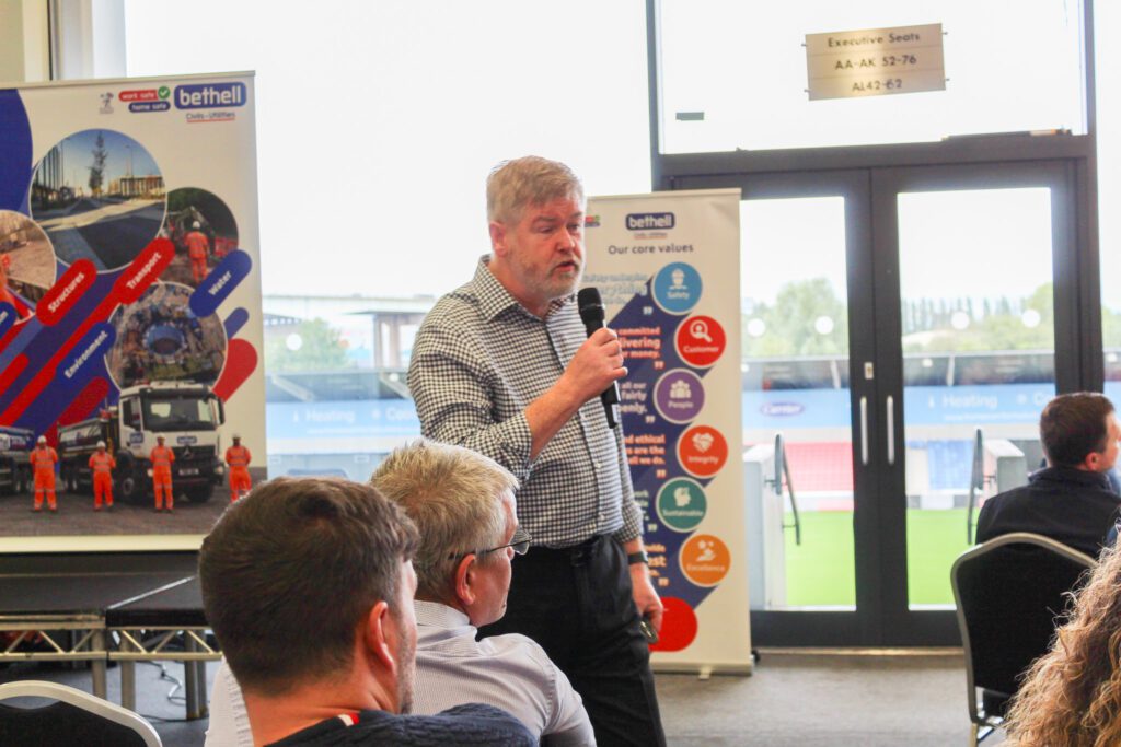 A speaker giving a presentation at an event