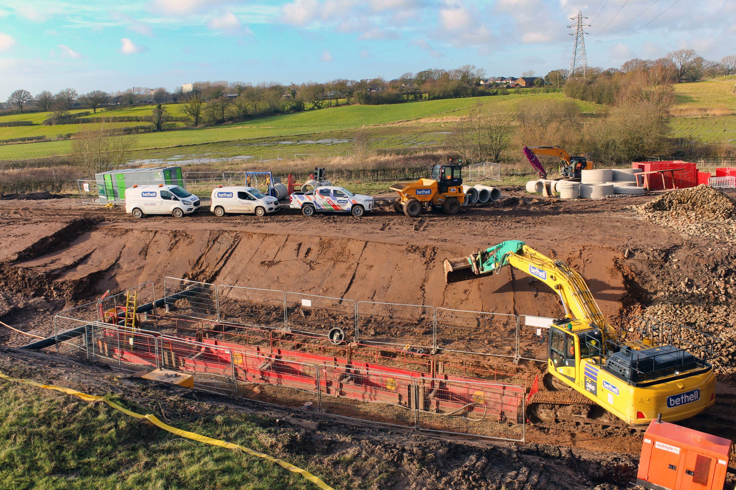A trench being excavated in a field