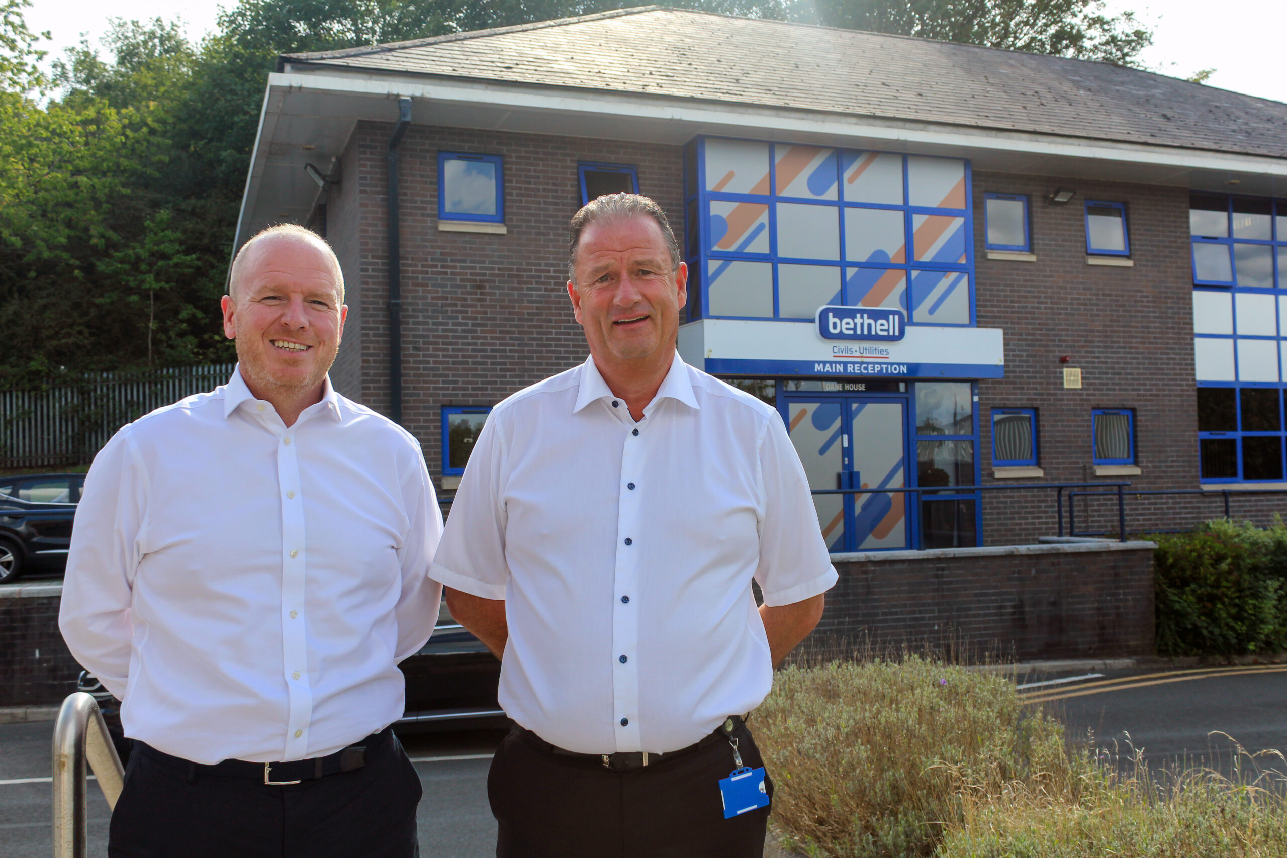 Two people stood outside Bethell offices